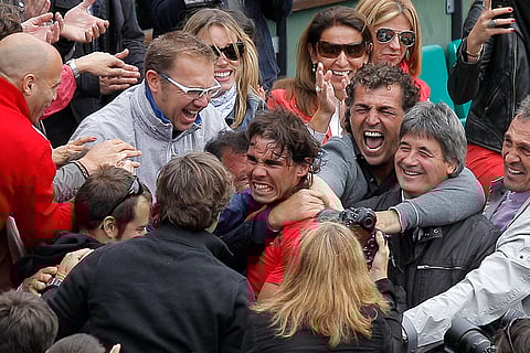 Rafael Nadal is congratulated by relatives
